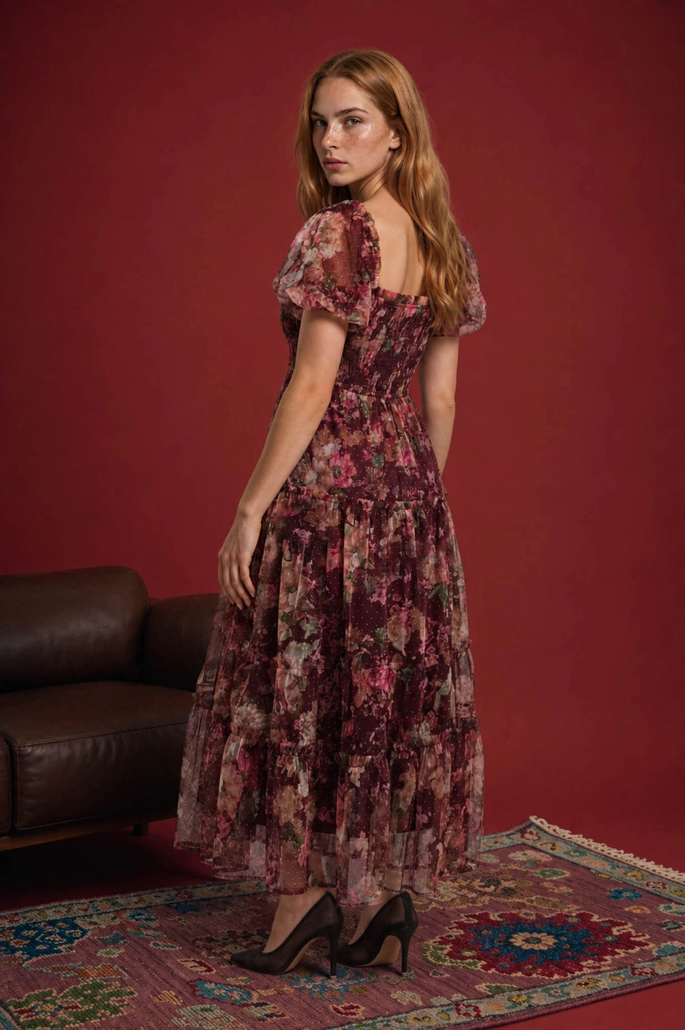 The Autumn Enchanted Orchard Tiered Tulle Midi Dress in burgundy floral tulle with puff sleeves and a flowing tiered midi skirt styled with heels