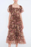 The Autumn Enchanted Orchard Tiered Tulle Midi Dress in a brown floral pattern with sheer puff sleeves, square neckline, and tiered midi skirt.