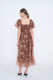 The Autumn Enchanted Orchard Tiered Tulle Midi Dress shown from the back with puff sleeves, a square neckline, tiered tulle skirt, and stretchable fit