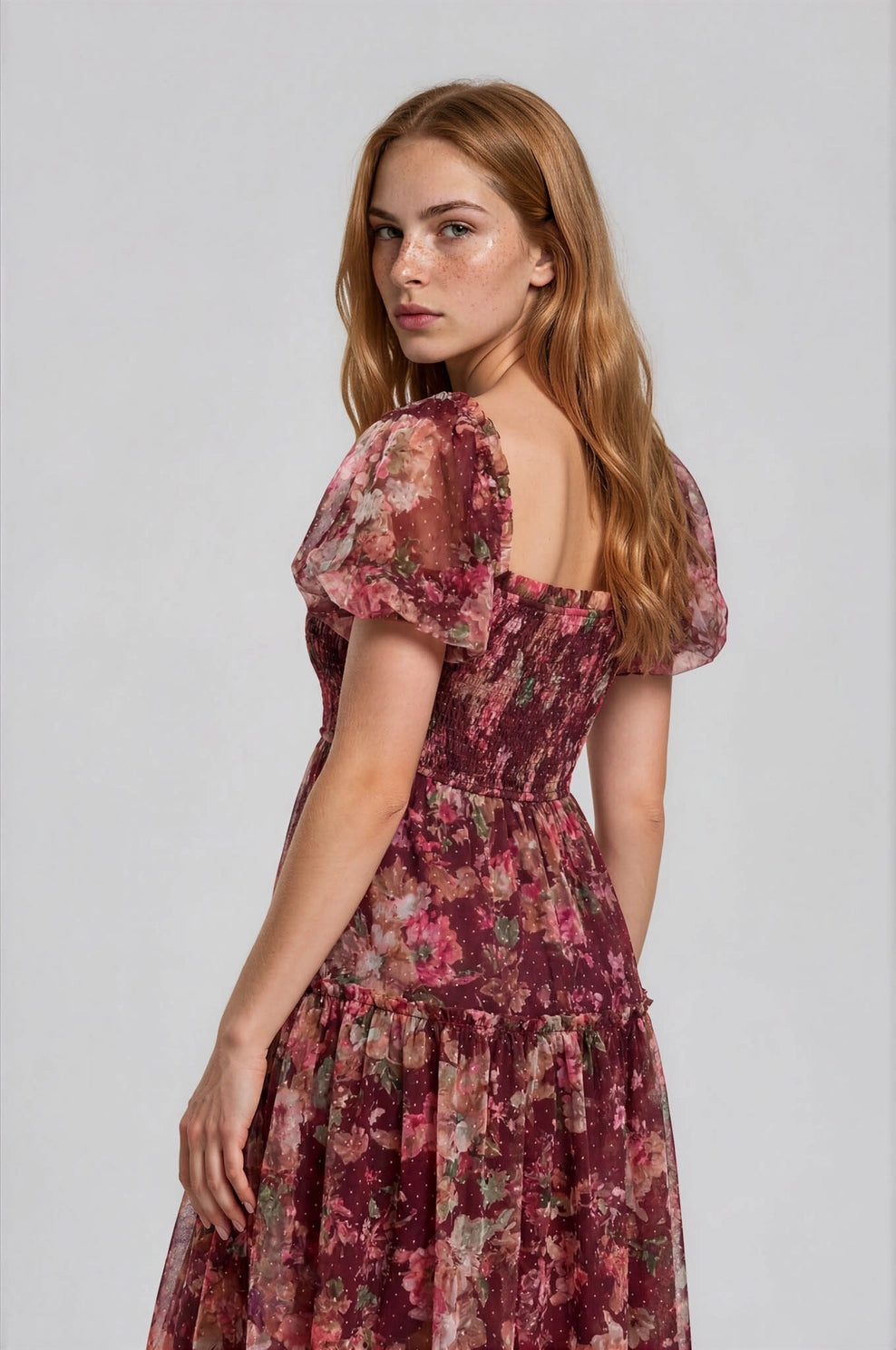 The Autumn Enchanted Orchard Tiered Tulle Midi Dress in a stretchable floral print with puff sleeves and a tiered skirt shown on a model