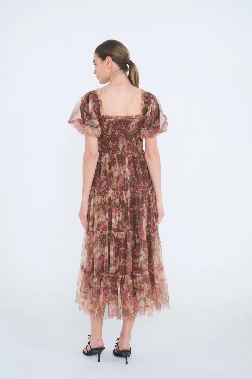 The Autumn Enchanted Orchard Tiered Tulle Midi Dress shown from the back with puff sleeves, a square neckline, tiered tulle skirt, and stretchable fit